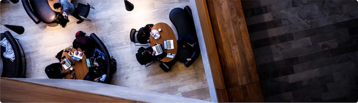 An overhead view of students sitting at tables.