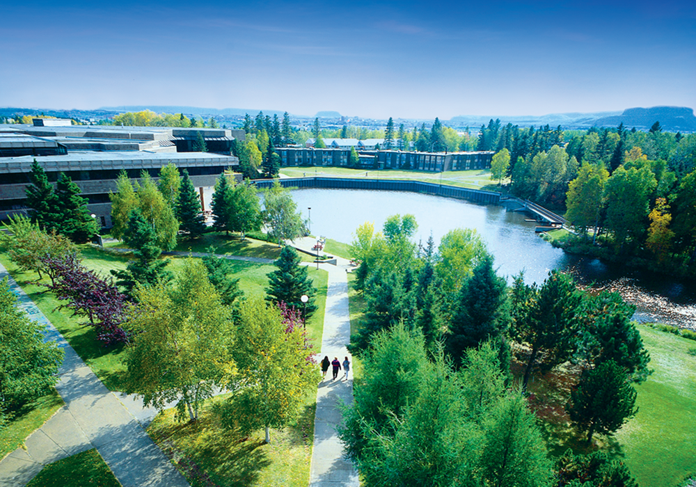Students walk on Lakehead's Thunder Bay campus near Lake Tamblyn.