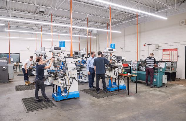 Pre-Apprenticeship Machinist students working.