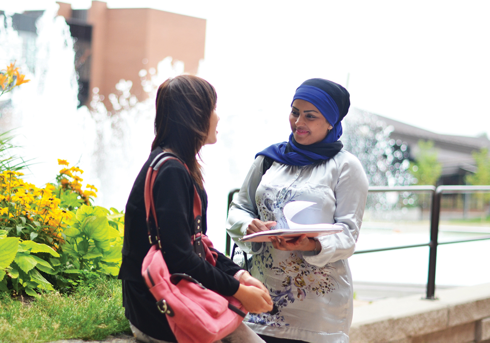 Cambrian College students near fountain