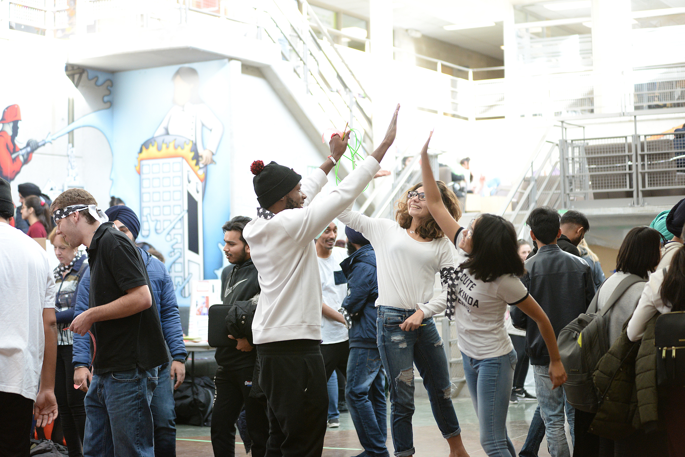 Students celebrating with high five