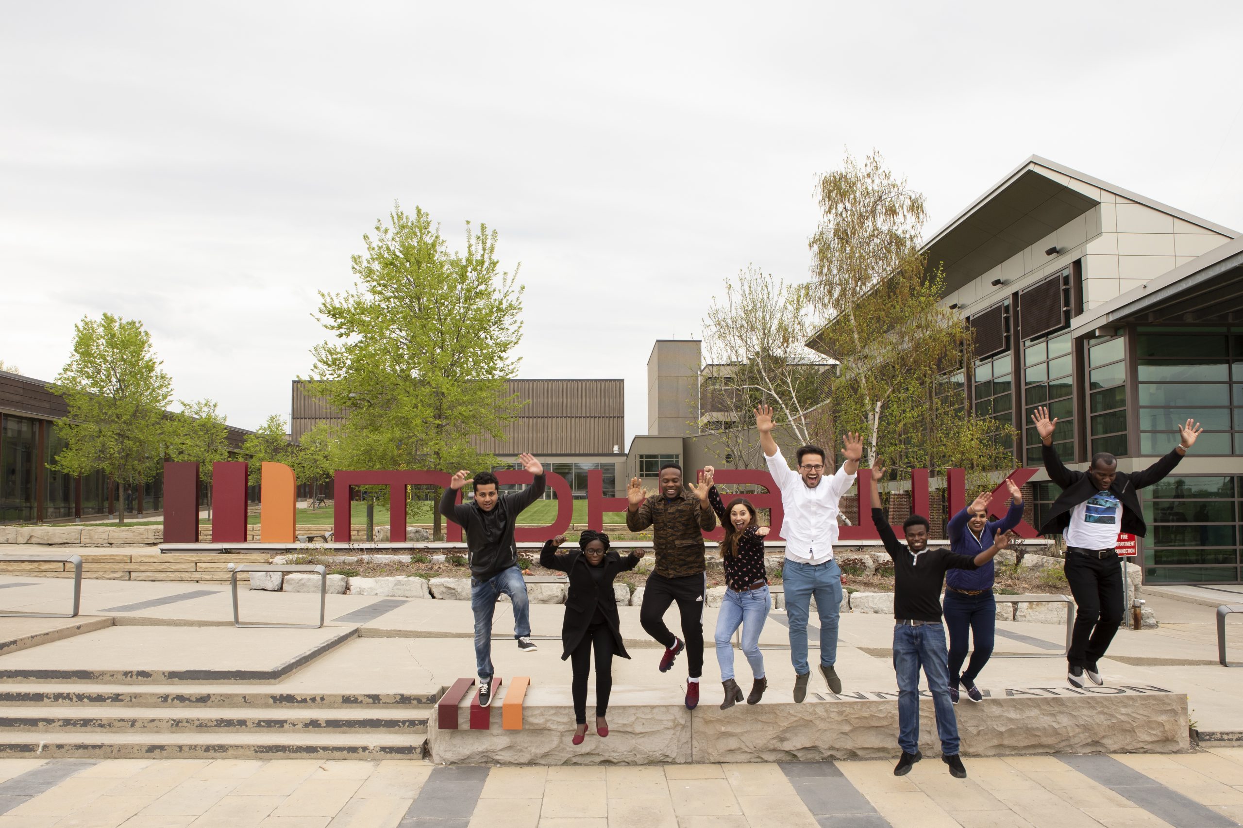 Students jumping with happiness