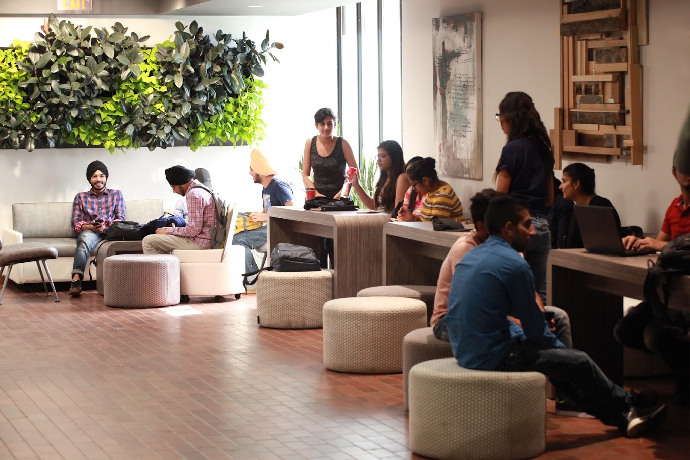 International students lounging and doing groupwork