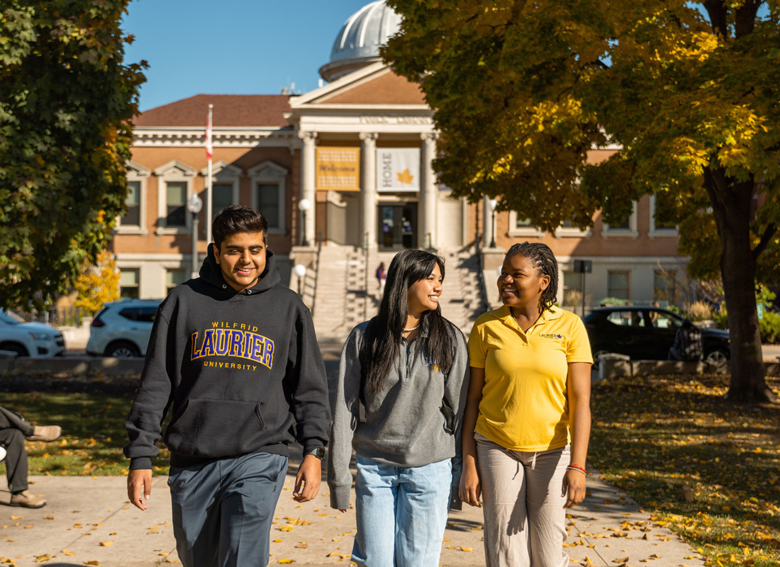 Students walking in front of the Carnegie Building