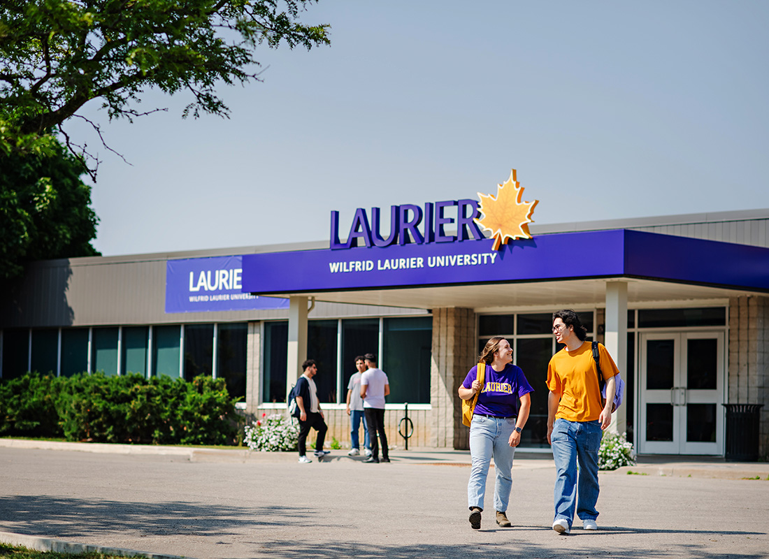 Students walking outside of the Milton campus main building